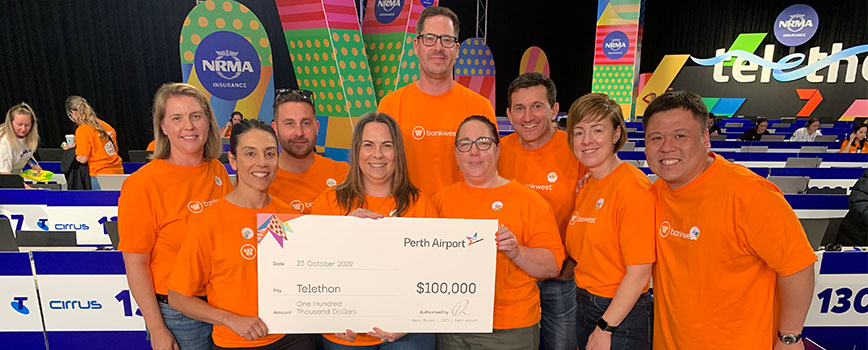 Perth Airport staff providing cheque to Telethon