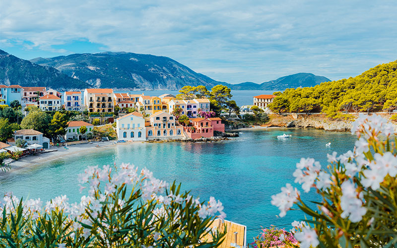 Coloured houses by the water front of Assos in Kefalonia, Greece