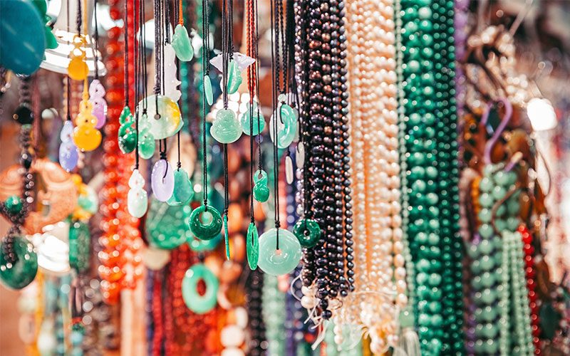 Colourful beaded necklaces hanging up