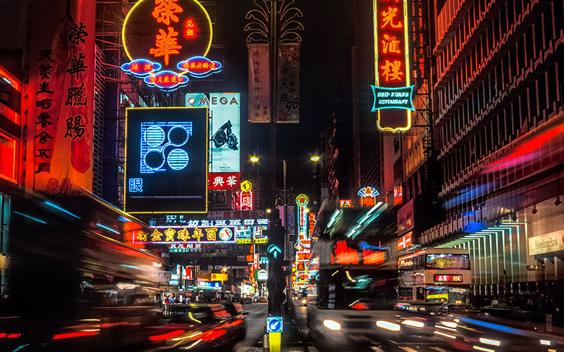 Neon signs illuminated in a street in Hong Kong at night