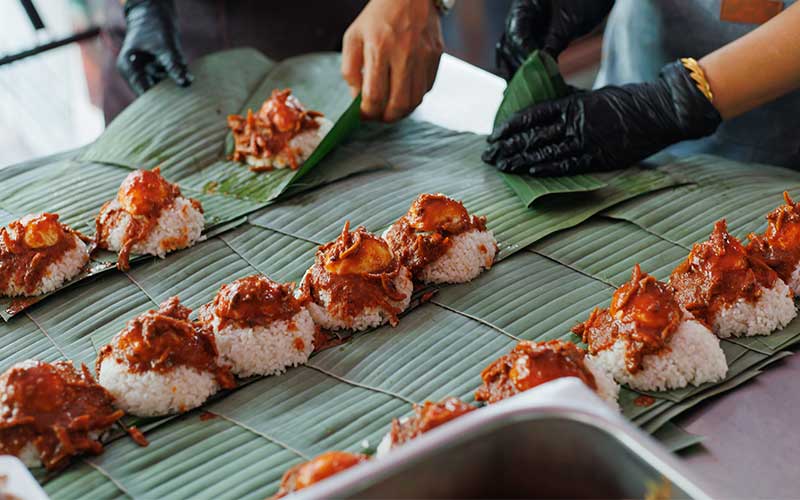 Traditional Malaysian food placed on leaves