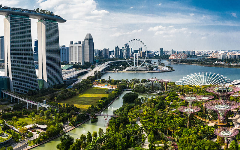 Skyscrapers and ferris wheel in Gardens by the Bay, Singepore