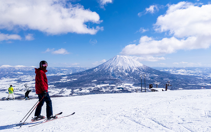 Skiers or snowboarders enjoying the panoramic views of Niseko, Hokkaido