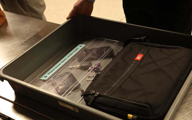 Security tray with laptop, keys and phone within