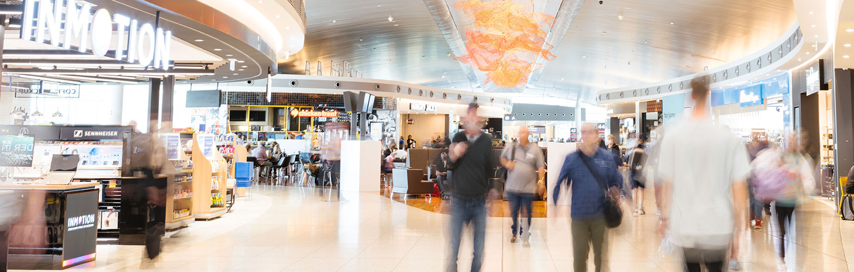 Passengers walking past tenancies in T1 Domestic Perth Airport